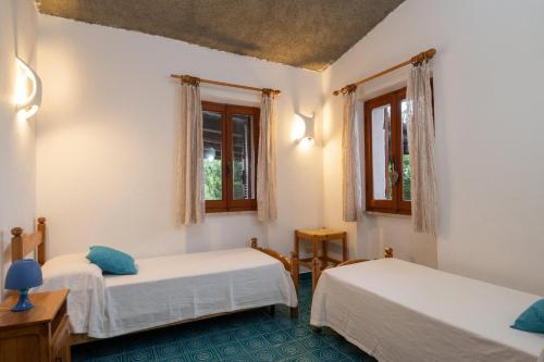 A bed or beds in a room at Villa Bados 8 - Klodge