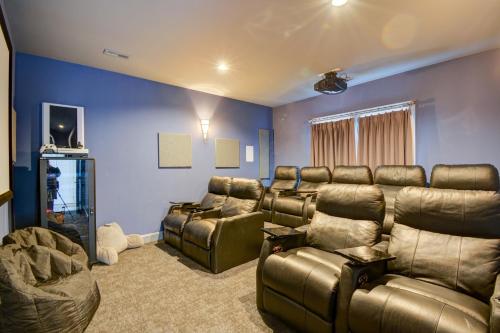 a living room with leather furniture and blue walls at Sounds Beachy in North Topsail Beach