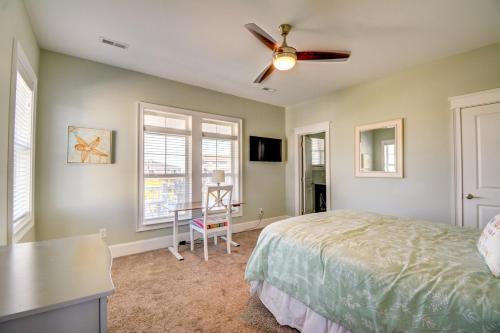 a bedroom with a bed and a ceiling fan at Sounds Beachy in North Topsail Beach
