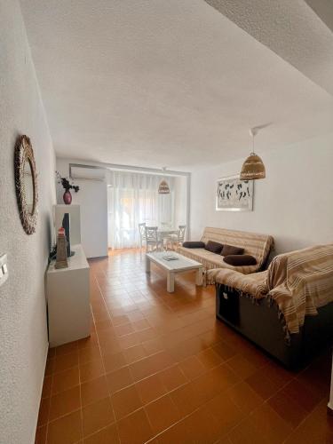 a living room with a couch and a table at La Mata relax in La Mata