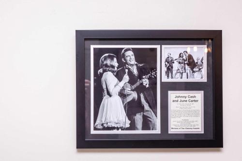 a framed photo of a bride and groom on a wall at First Floor Suites at The Legacy Inn Harmony Floor in Luray