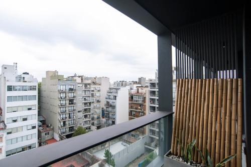 a balcony with a view of a city at Babel Arcos in Buenos Aires