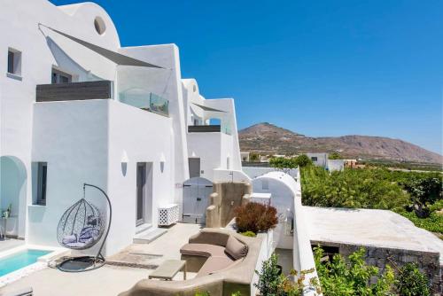 a villa with a view of the ocean at White Harmony Suites in Megalokhori