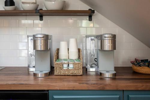 a kitchen counter with two appliances on a counter top at The Legacy Suites Collection Full Property Rental in Luray