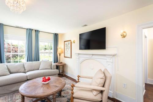 a living room with a couch and a fireplace at The Legacy Suites Collection Full Property Rental in Luray