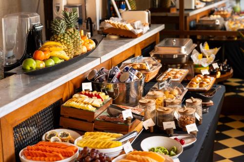 a buffet with many different types of fruits and pastries at Sophia Hotel By OxoHotel in Cartagena de Indias