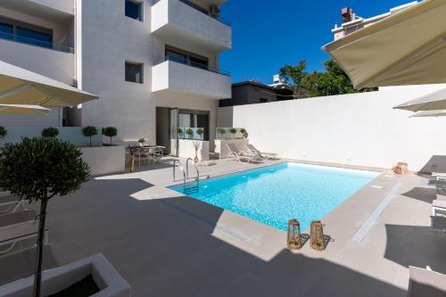 a swimming pool in the backyard of a house at Selected Suites in Chania Town