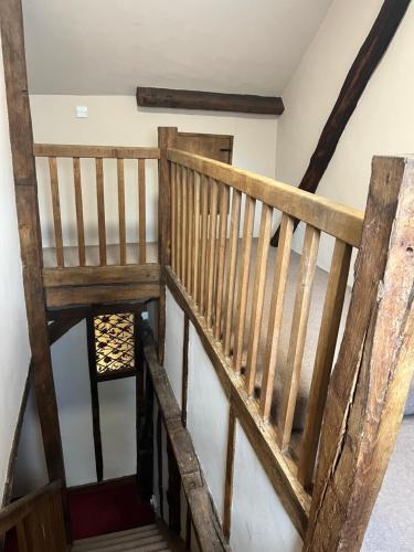 an overhead view of a wooden staircase in a house at Chilton Manor House in Murston