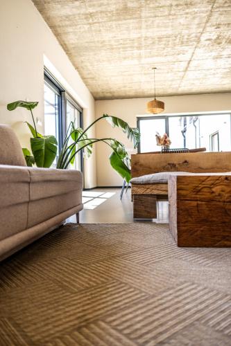 a living room with a couch and a table at Vilabyt se zahrádkou a výhledem na zámek in Mikulov