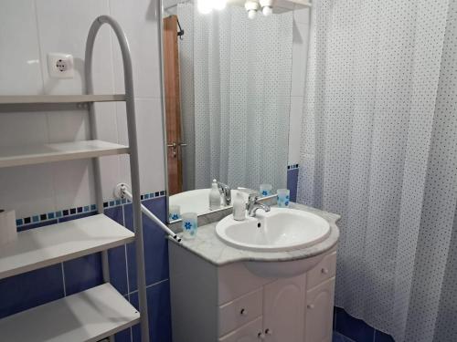 a bathroom with a sink and a shower at Apartamento T3 sta luzia in Santa Luzia