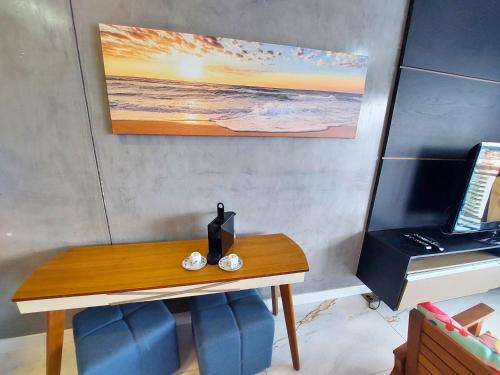 a table with a penguin sitting on top of it at Book Santos - Unlimited 2611 - Studio conceito com Vista Mar in Santos