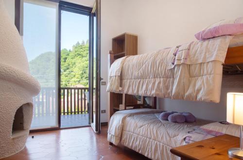 Posteľ alebo postele v izbe v ubytovaní Villa Olga Lago Maggiore