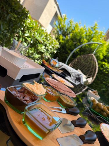 a table with food on top of it at Luxury Villa with Private Pool Garden Lake View in Sapanca in Sapanca