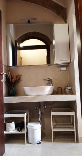 a bathroom with a sink and a mirror at Antico Casolare in San Gimignano