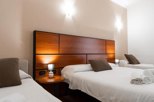 Postel nebo postele na pokoji v ubytování Hotel City Center