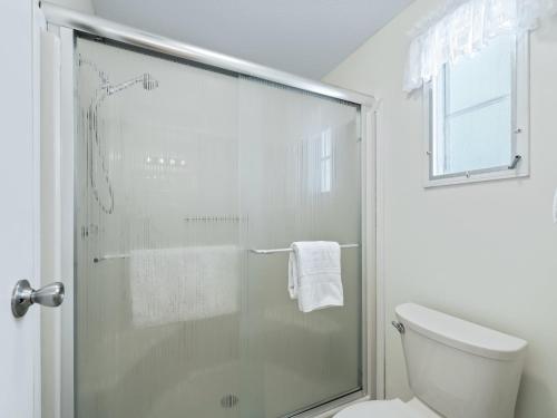 a bathroom with a glass shower with a toilet at 1640 Z1 VILLAGE OF COUNTRY CLUB HILLS by REMAX Premier in The Villages