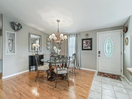 a dining room with a table and chairs at 1640 Z1 VILLAGE OF COUNTRY CLUB HILLS by REMAX Premier in The Villages