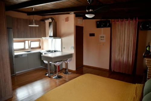 a kitchen with a sink and a counter top at Panoramic deluxe penthouse in Thérissos