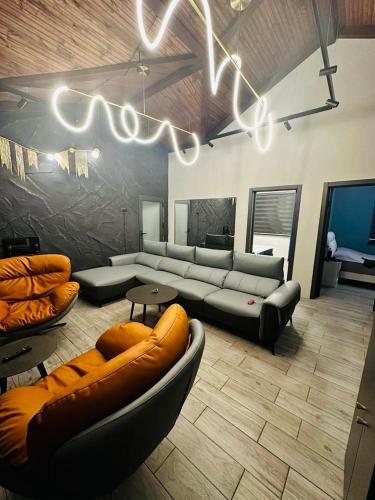 a large living room with a couch and a table at Suntau in Almaty