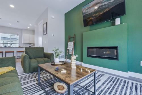 a living room with a couch and a fireplace at 3br W King Bed, Sauna, Parking-6 Min To Olde Town in Arvada