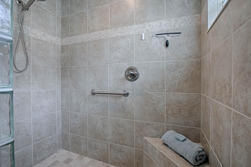 a bathroom with a shower with a tiled shower at 1987 Z3a Village of Pennecamp by REMAX Premier in The Villages