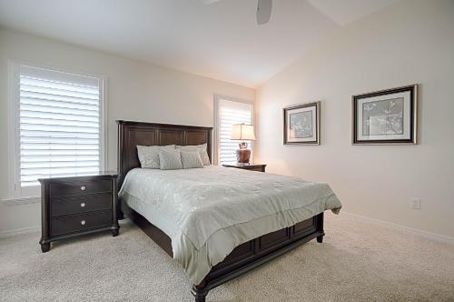 a bedroom with a large bed and a window at 1987 Z3a Village of Pennecamp by REMAX Premier in The Villages