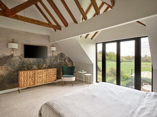 Voodi või voodid majutusasutuse Charming 4-Bedroom Cottage in Henley toas