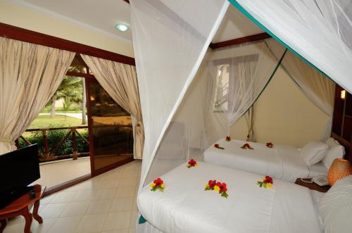 Postel nebo postele na pokoji v ubytování Kae Beach Resorts