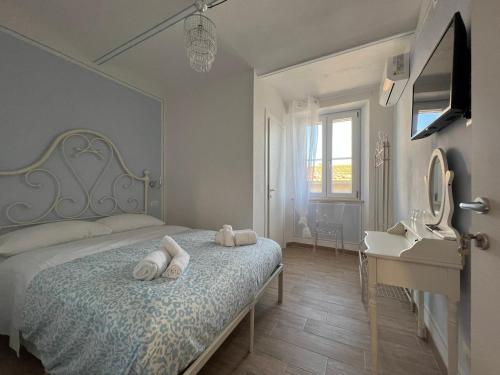 a bedroom with a bed and a sink and a mirror at La Dimora dei Magi in Saturnia
