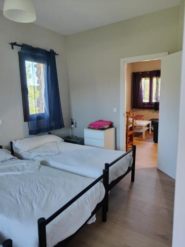 a bedroom with two beds and a window at Centro Ecoturismo Barbatona Sigüenza in Barbatona
