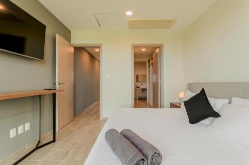 Postel nebo postele na pokoji v ubytování EHDEN Vacation Suites Puerto Cancún