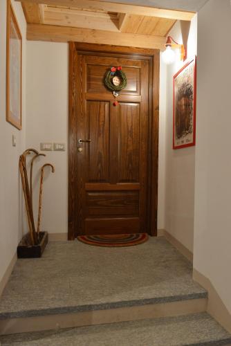 a hallway with a wooden door in a house at Hotel Du Grand Paradis - 1899 Auberge Boutique in Cogne