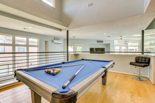 a pool table in a large room with at Exquisite Canal-Front Home Access to Lake Conroe! in Montgomery