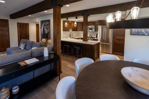a kitchen and living room with a couch and a table at The Chateaux Deer Valley in Park City