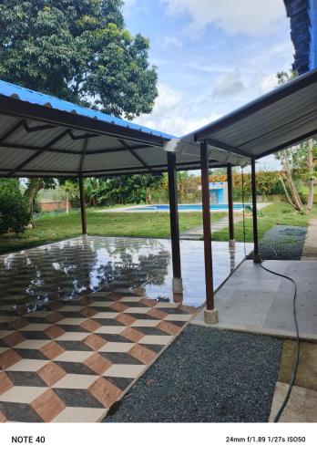 a pavilion with an umbrella on a patio at Villa RIVAR in Santa Helena