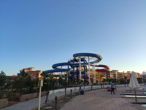 a ride at a water park with a roller coaster at Elegant Apartments & Aquapark - B&B- FREE WI-FI-Sharm El Sheikh in Sharm El Sheikh