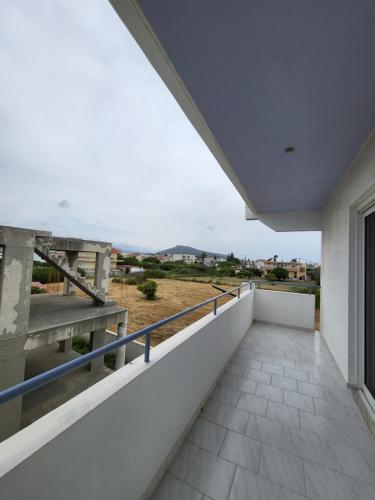 a balcony of a house with a view at Pyrgos Hotel Apartments in Kremasti