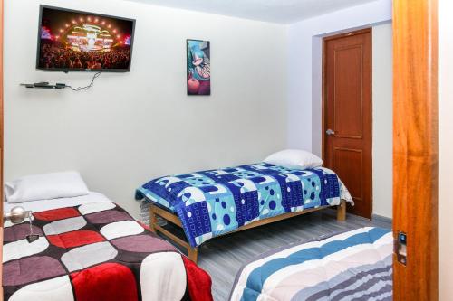 Cama o camas de una habitación en TRANSFER VIP HOSTEL