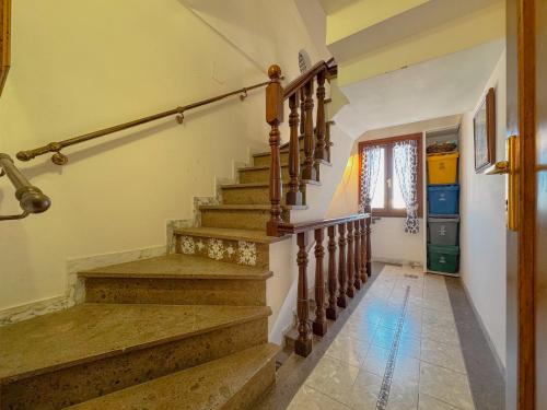 a staircase in a home with a stair case at 49 Sea Rooms - Guesthouse by Host Hero in Stintino