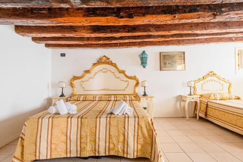 Postel nebo postele na pokoji v ubytování Casa Leone- cozy and central accommodation in Venice
