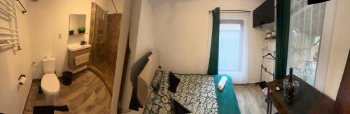 Ένα ή περισσότερα κρεβάτια σε δωμάτιο στο Insomnia Apartments