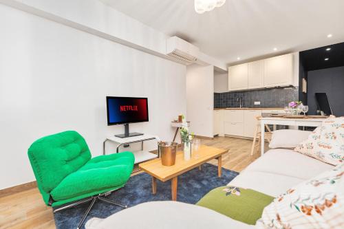 a living room with a couch and a table at 2mn Monaco - Coquet appartement rénové - DM in Roquebrune-Cap-Martin