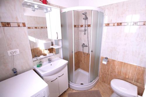 Koupelna v ubytování Apartments Mima
