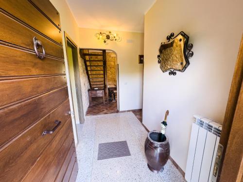 a room with a wooden door and a hallway at Villa Visocchi Bed and Breakfast in Atina