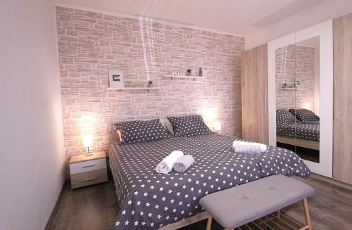 Postel nebo postele na pokoji v ubytování Apartments Mima