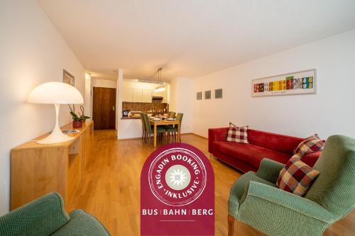 a living room with a bus boston berriensteen sign in the middle at Chasa Plavna in Vulpera