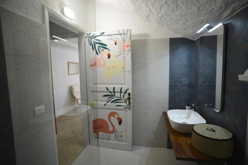 a bathroom with a toilet and a sink and a shower at Kite Hostel Stagnone in Marsala