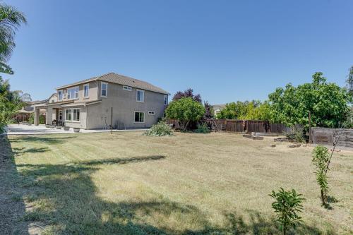 a large yard in front of a house at Family Home with Patio and Fenced Yard in Brentwood in Brentwood