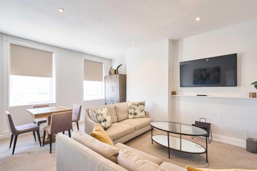 a living room with a couch and a table at Host & Stay - Albert House in Weymouth