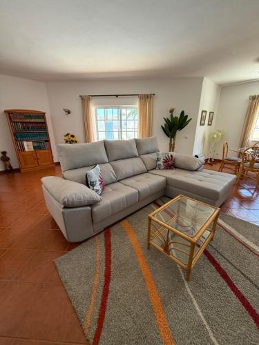 a living room with a couch and a coffee table at Villa Barros by GalanteVasques in Carvoeiro